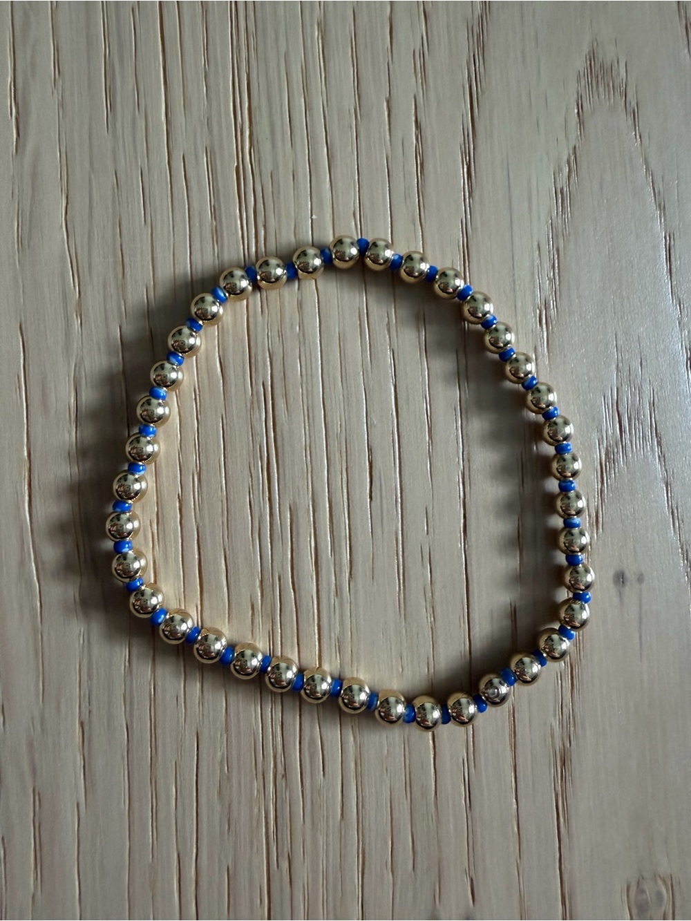 2 BaubleBar bracelets—one letter “N”
